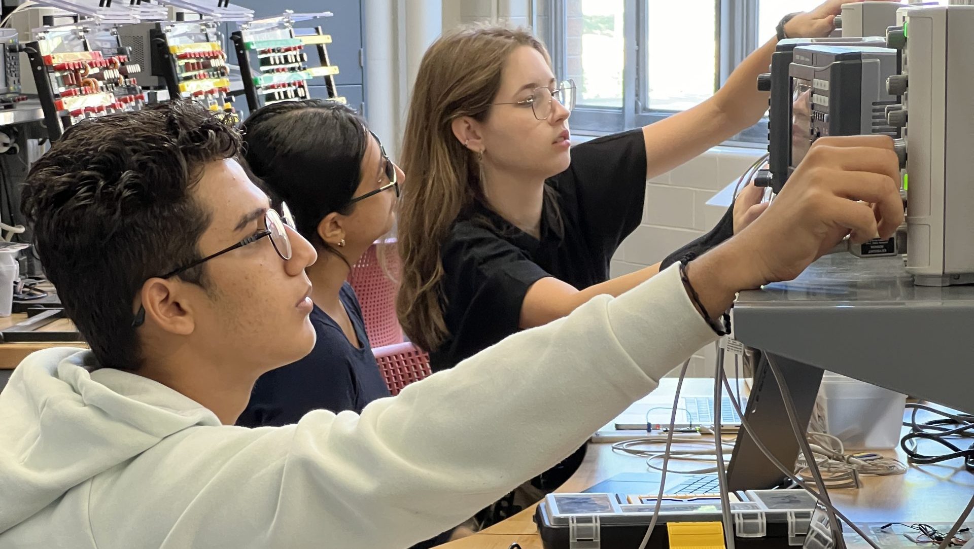 Students working at a lab bench in the Thompson Electronics Design Studio
